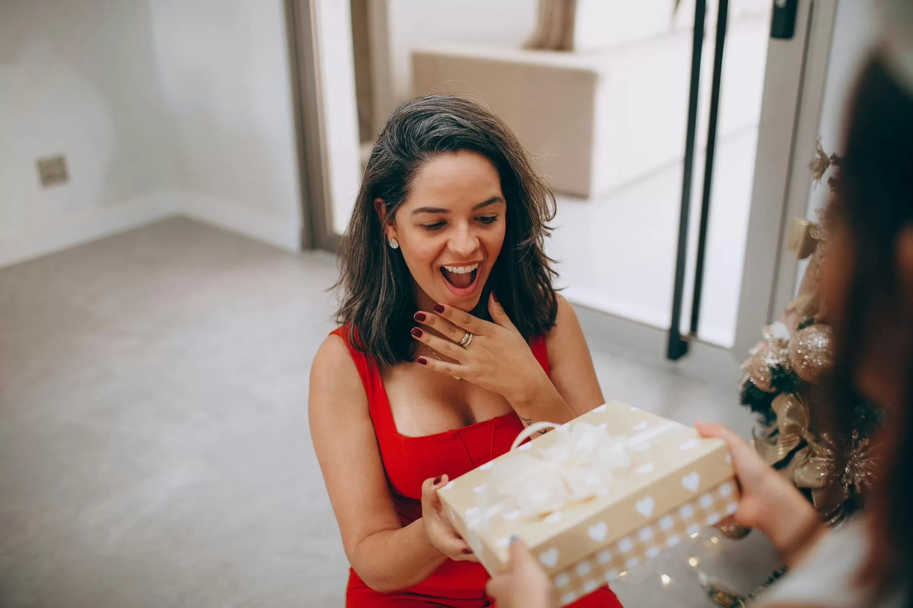 smiling woman with christmas gift